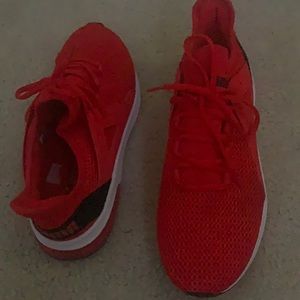 Unisex red, white, and black Puma running shoes